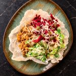 Caesar Pulled Chicken on rice leaves with Bjäre Chicken