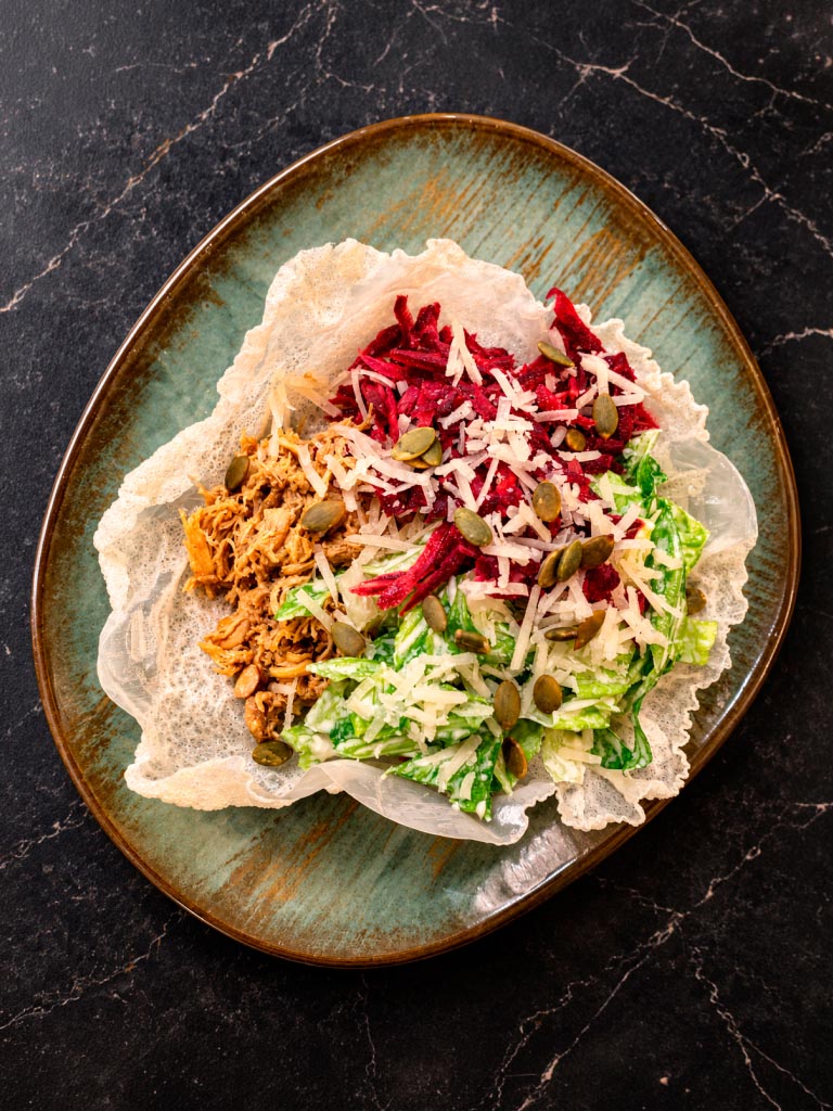 Caesar Pulled Chicken on rice leaves with Bjäre Chicken
